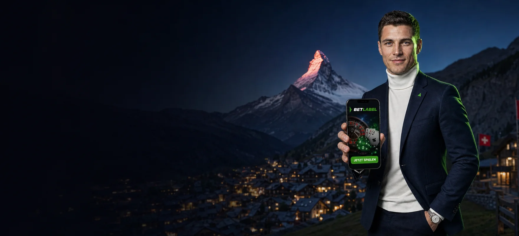 Mann im mitternachtsblauen Blazer zeigt ein Handy mit der BetLabel App vor dem Matterhorn im Abendrot über den Lichtern von Zermatt